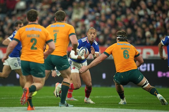 France’s Gael Fickou runs with the ball.