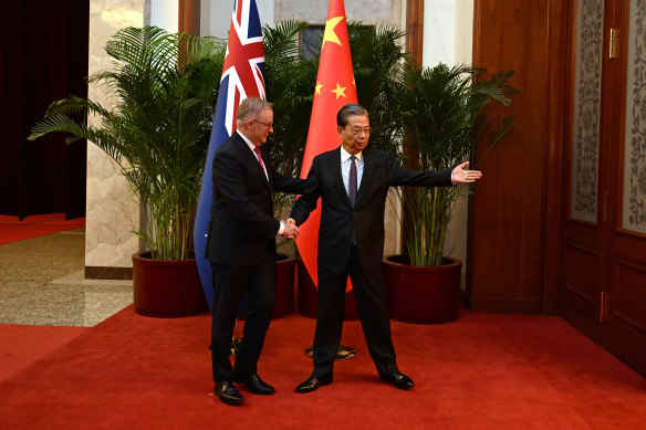 Chairman of the National People’s Congress Zhao Leji greets Prime Minister Anthony Albanese in the Great Hall of the People in Beijing on Monday.