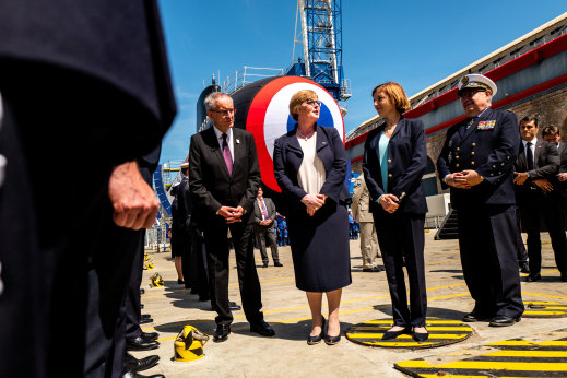 Thoroughly charmed: French President Emmanuel Macron made sure then defence minister Linda Reynolds, seen here with her French counterpart Florence Parly, was invited to the launch of the first of France’s newest class of nuclear-powered submarines, the Barracuda, in Cherbourg in 2019. 