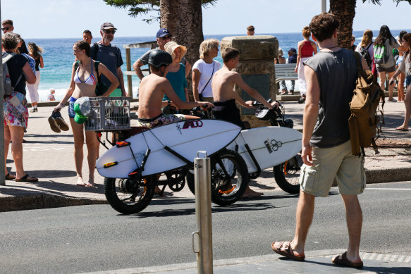 Teens on fat bikes at the beach.