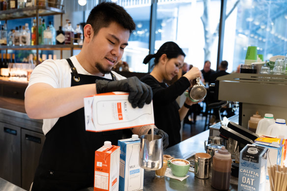Barista Nando Lim from Bar Lume pours MILKLAB milk to make coffee. Most baristas don’t know about Noumi’s colourful corporate history.