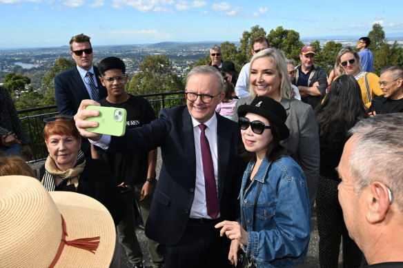 Prime Minister Anthony Albanese is seen with supporters at the Mount Coot-Tha Lookout on Thursday morning.