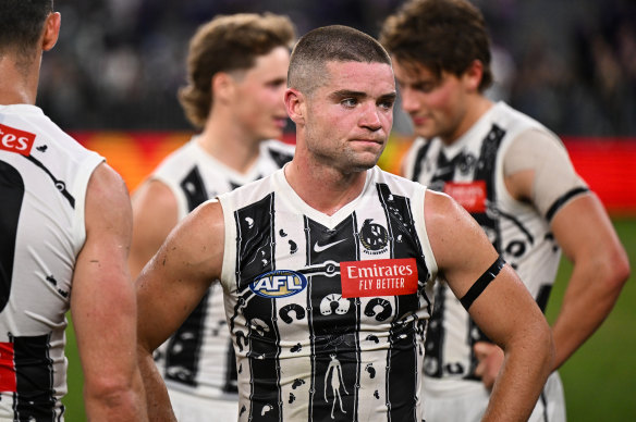 Lachlan Sullivan was controversially penalised for handing the ball to Nick Daicos, instead of the umpire.