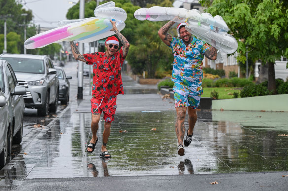 Jack Gibson and Ryan Last celebrate Christmas in the rain. 