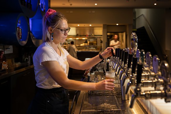 Bar worker at Crows Nest Hotel in Sydney.
