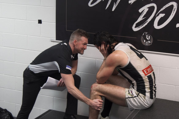 Nathan Buckley consoles ruckman Brodie Grundy in 2018 when both were at Collingwood and featured in the documentary Collingwood: From the Inside Out.