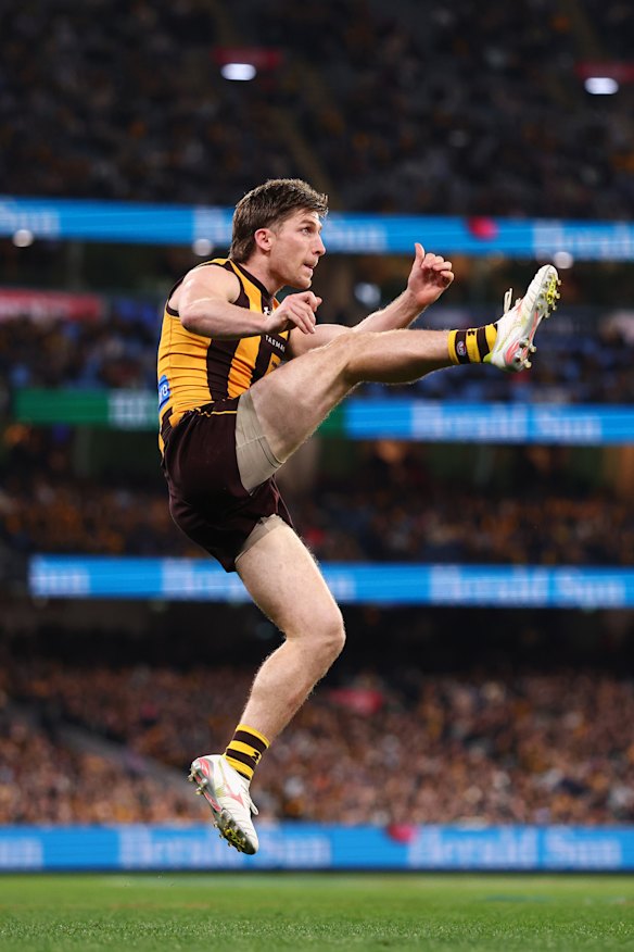 Hawthorn’s Dylan Moore launches his shot at goal.