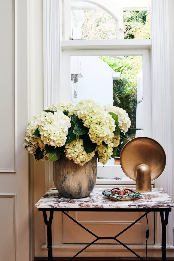 “The console table welcomes you into the house and it reveals its details as you walk up the hallway,” says Ashford. “The mix of vintage and contemporary objects has a story to tell.”