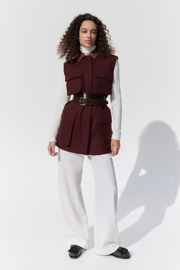 Uniqlo cashmere turtleneck (worn throughout), $130. Max Mara sleeveless coat, $4285, belt, $640, and pants, $1610. Weekend Max Mara x Sebago loafers, $915.