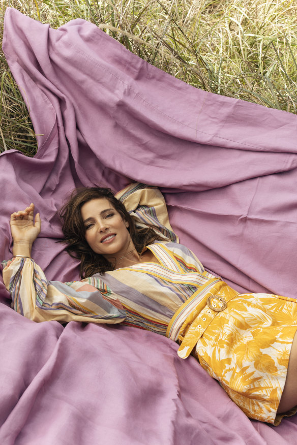  Zimmermann “Mae” top, $395, and shorts, $375. Sheridan “Abbotson” linen sheet.