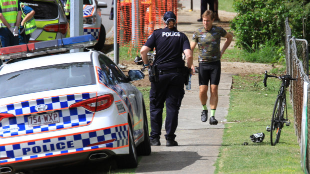Police investigate a fatal cyclist crash in Indooroopilly as the man's friend leaves the scene.