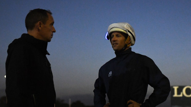 How is she: Trainer Chris Waller and jockey Hugh Bowman after Winx's gallop at Rosehill on Thursday.