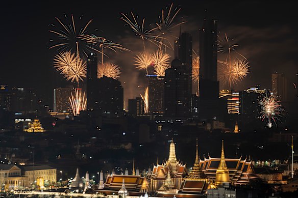 Thais took to the shore of the Chao Phraya river in Bangkok in large numbers to ring in the new year. 