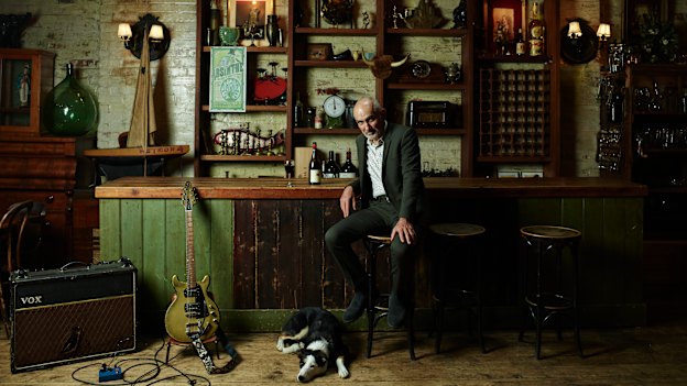 Paul Kelly (with dog Queenie) at Bakehouse Studios, the rehearsal space he uses in Melbourne’s Richmond. “You can’t see the next song coming. They catch you by surprise, or by accident … you have to keep 
your ears open,” he says of his 40-year songwriting career.
