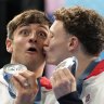 Britain’s Thomas Daley, left, and Noah Williams celebrate on the podium after winning the silver medal in the men’s synchronised 10m platform diving final.