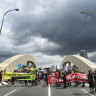 Activists end week of climate protests by shutting down Brisbane bridge
