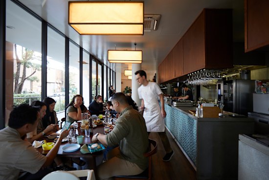 Yan’s dining room feels much cosier than the building it inhabits.