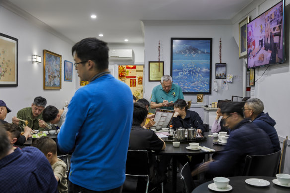 Anthony Kwok (standing, at rear) taking orders at Beverly Hills Chinese.