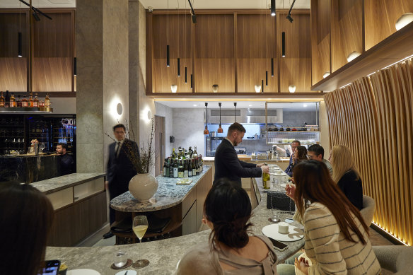 Allta’s timber slats arch over diners like a blond wood Hokusai wave.