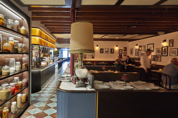 The soft-lit dining room at Restaurant Santino.