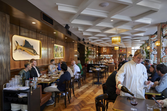 The interior features chandeliers, vintage posters and a tin marlin from Mexico (left).