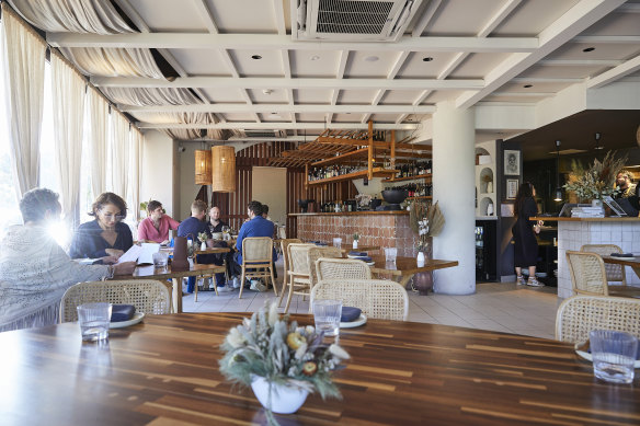 Osteria Il Coccia’s plush, coastal chic dining room.