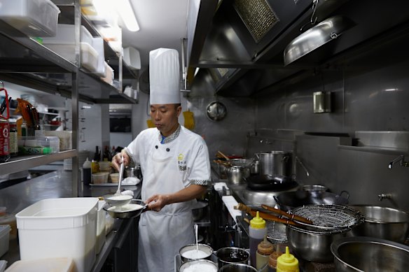 Preparing stir-fried milk skin at Taste of Shunde.