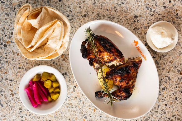Charcoal chicken with Lebanese bread, toum and pickles at Henrietta in Surry Hills.