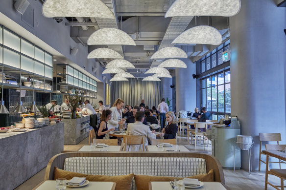 The dining room is decked out in soft oak and steel-blue hues.