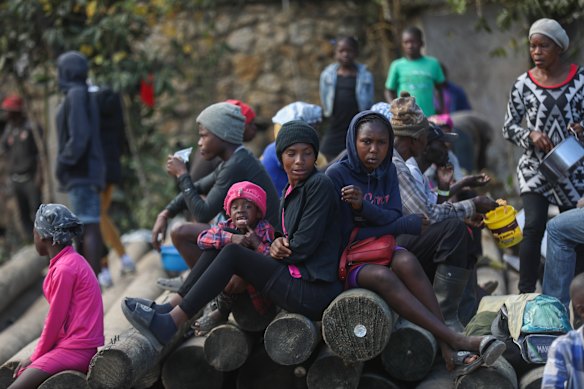 People displaced by armed gang attacks take refuge in the town hall of the Kenscoff neighborhood of Port-au-Prince, Haiti.