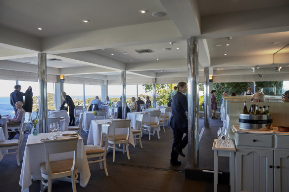 The dining room’s beige-on-cream interior is “function centre meets cosmetic surgeon’s superyacht”.