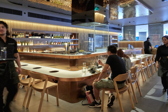 Induction cooktops heat the broth at Hanasuki in Chatswood.