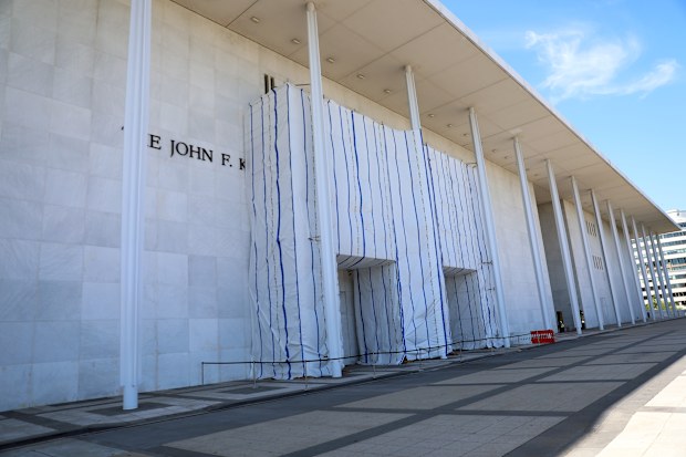 The front of the Kennedy Centre has been covered by a tarpaulin for months after a judge ordered Donald Trump’s name be removed.