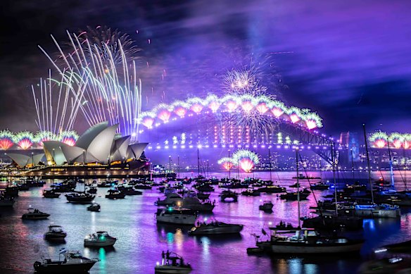 The harbour glows blue during New Year’s Eve celebrations