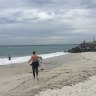 Perth surfers enjoy rare cyclone swell as shark warning issued down South