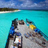 The barge and the tip of North West Island, Queensland.