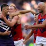 Patrick Voss of the Dockers taunts Harrison Petty of the Demons.