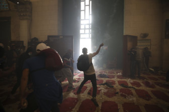 Palestinians clash with Israeli security forces at the Al-Aqsa Mosque compound in Jerusalem’s Old City.