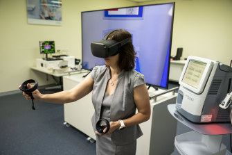 Werfen Australia New Zealand General Manager Sally Hickman demonstrates virtual reality blood testing.