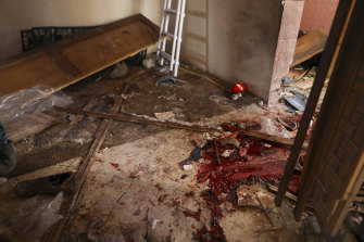 Blood covers the floor of a destroyed house after an operation by the US military in the Syrian village of Atmeh in Idlib province on Thursday. Local residents and activists said civilians were among those killed.