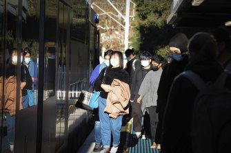 Masked up Sydneysiders. 