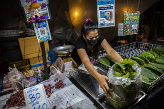 A vendor in the Din Daeng Market in Bangkok sells kratom leaves. 