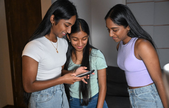 Identical triplets (left to right) Suruthi, Swathi and Surabhi Tharmaseelan viewing their VCE results on Monday morning.