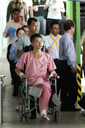 Rescued tourist Huang Junxiong is wheeled back to his bed at the Vachira Phuket Hospital.
