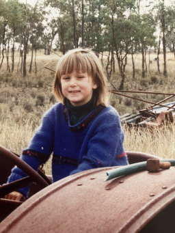 Annabel Johnson as a child helping out on the farm in Young.