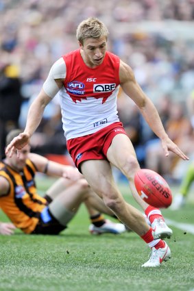 Keiren Jack leaves a Hawthorn player in his wake during the 2012 grand final.