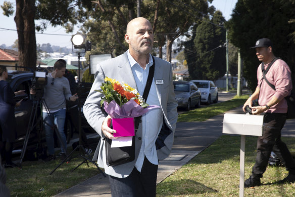 A chaplain arrives at the home of Sydney stabbing suspect Mert Ney. 
