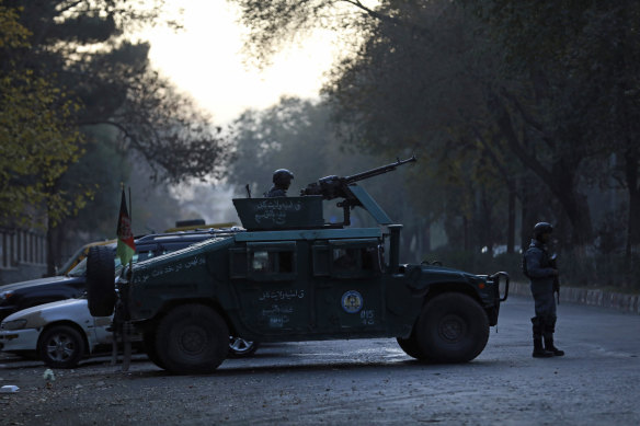 Police patrol Kabul University after the attack earlier on Monday.