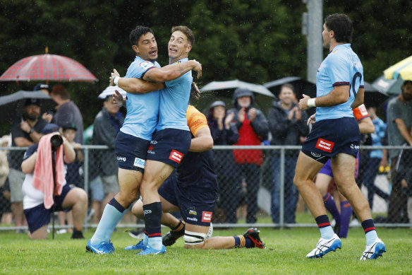 Lalakai Foketi celebrates after scoring a try.