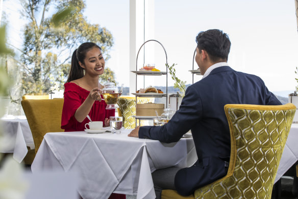 An elegant high tea at Wintergarden with vistas stretching across the Mountains.